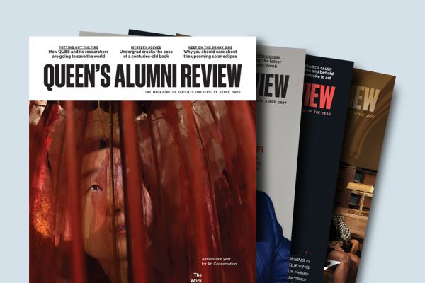 Four Alumni Review issues on display.