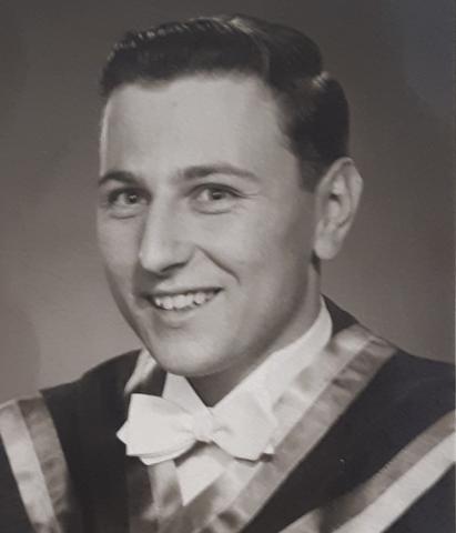 Graduation photo of a man.
