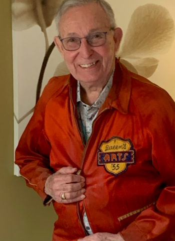 Cecil Adams proudly sporting his Queen's '55 Arts jacket.