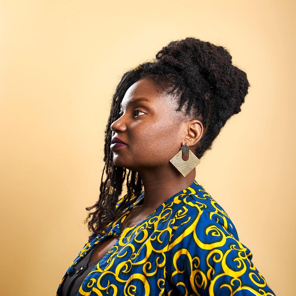 portrait of Grace Adeniyi-Ogunyankin against a yellow background