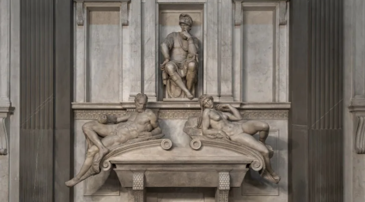 Three statues of people
