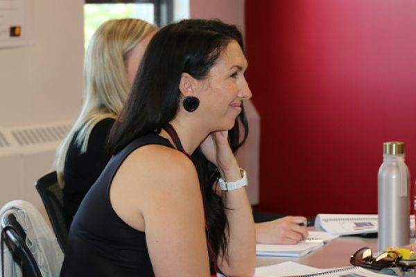 Woman listening in a classroom.