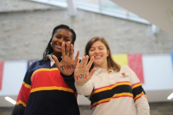 Students supported by the Dean of Arts Trust Fund with "thank You' Written on their hands