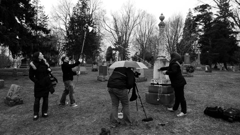 People using equipment in a cemetery