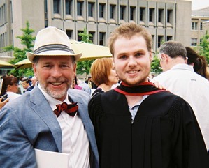 A student smiling with a faculty member