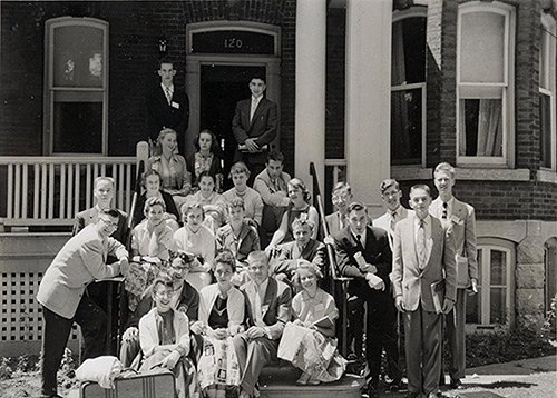 [Science ’44 Co-op residents gathered on the steps of one of their houses in the late 1950s]