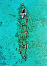 a shipwrecked boat in the ocean