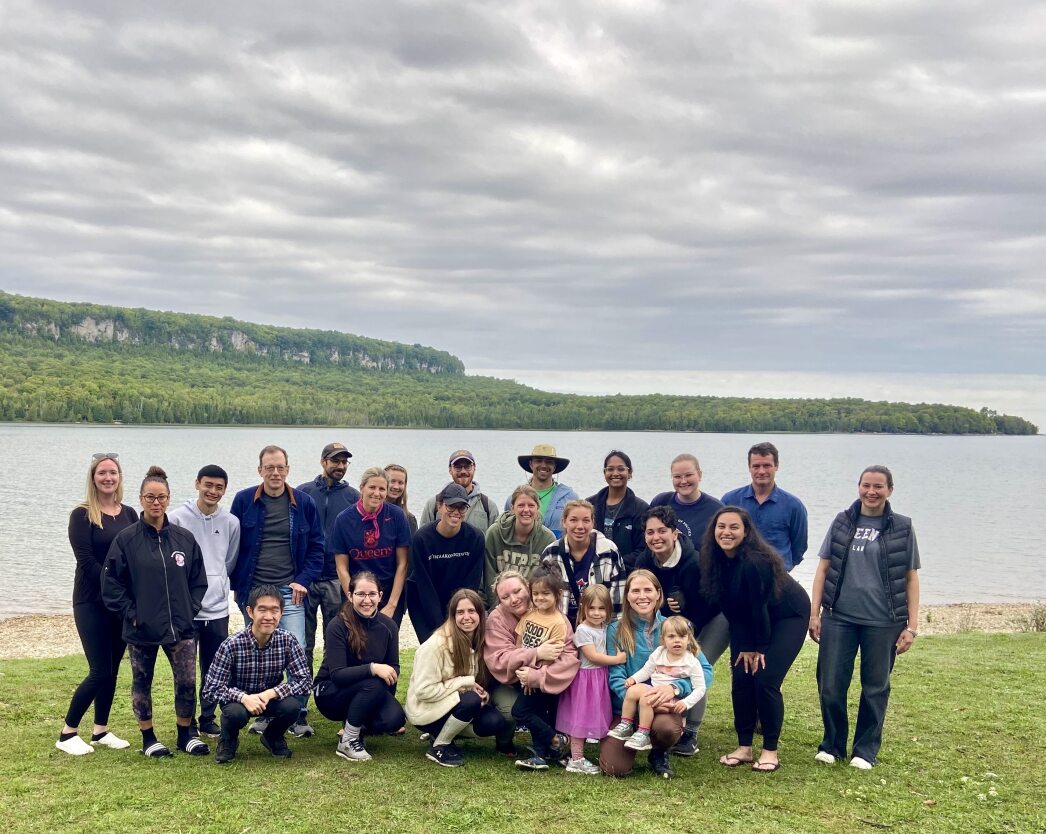 Students, faculty and staff from Queen’s University Faculty of Law gather for a photo on Georgian Bay at the end of the course. 