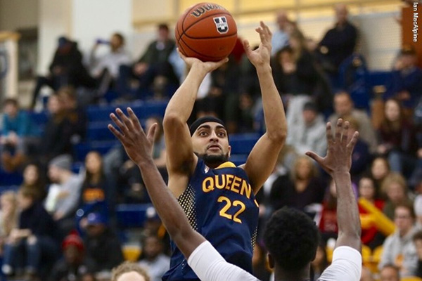 Jaz Bains puts up a shot in men's basketball