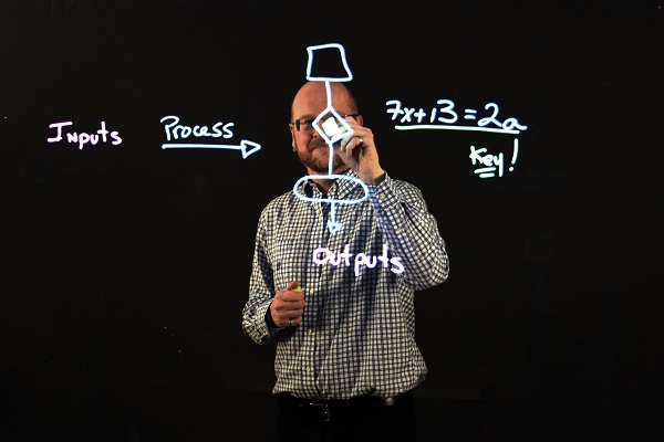 [Eric Tremblay shows how the lightboard works] (Photo: PPS)