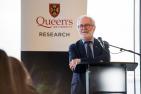 Principal Patrick Deane welcoming Queen’s research award recipients.