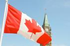 Canadian flag flies in front of the Peace Tower on Parliament Hill in Ottawa.