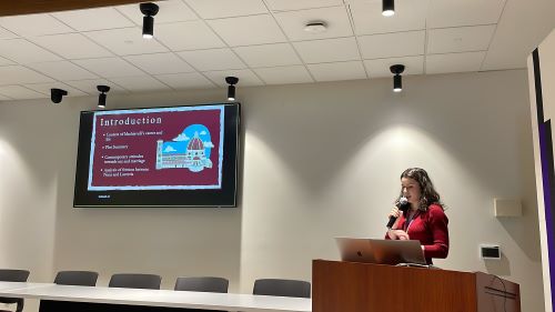 An image of Isobel Gibson presenting her research at the I@Q Conference in Stauffer Library