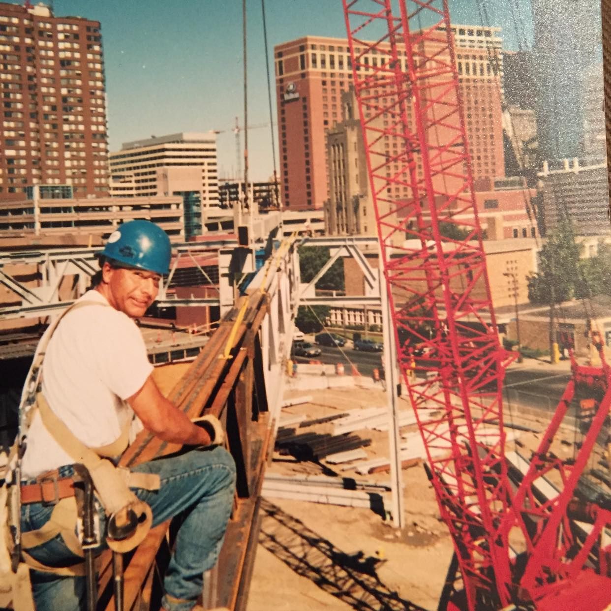 An iron worker completing a construction project. 