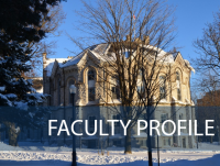 A building on Queen's campus with the words "Faculty Profile"