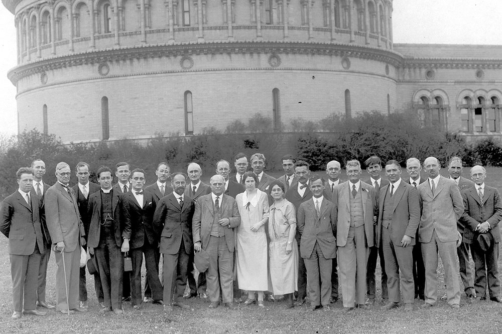 [historical image, researchers in front of observatory]