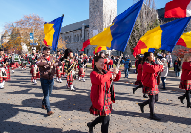 Homecoming parade with flagbearers