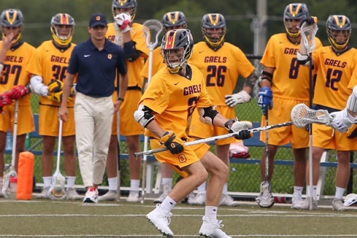 Men's Lacrosse player with team in background