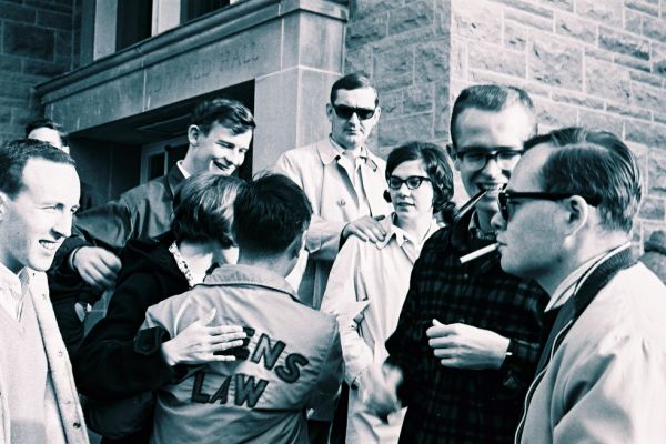 1960s Law students standing on the steps of the Law Building