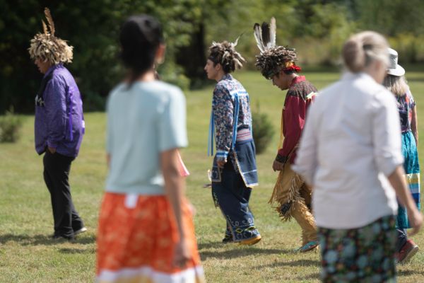 A group of people walk in a circle