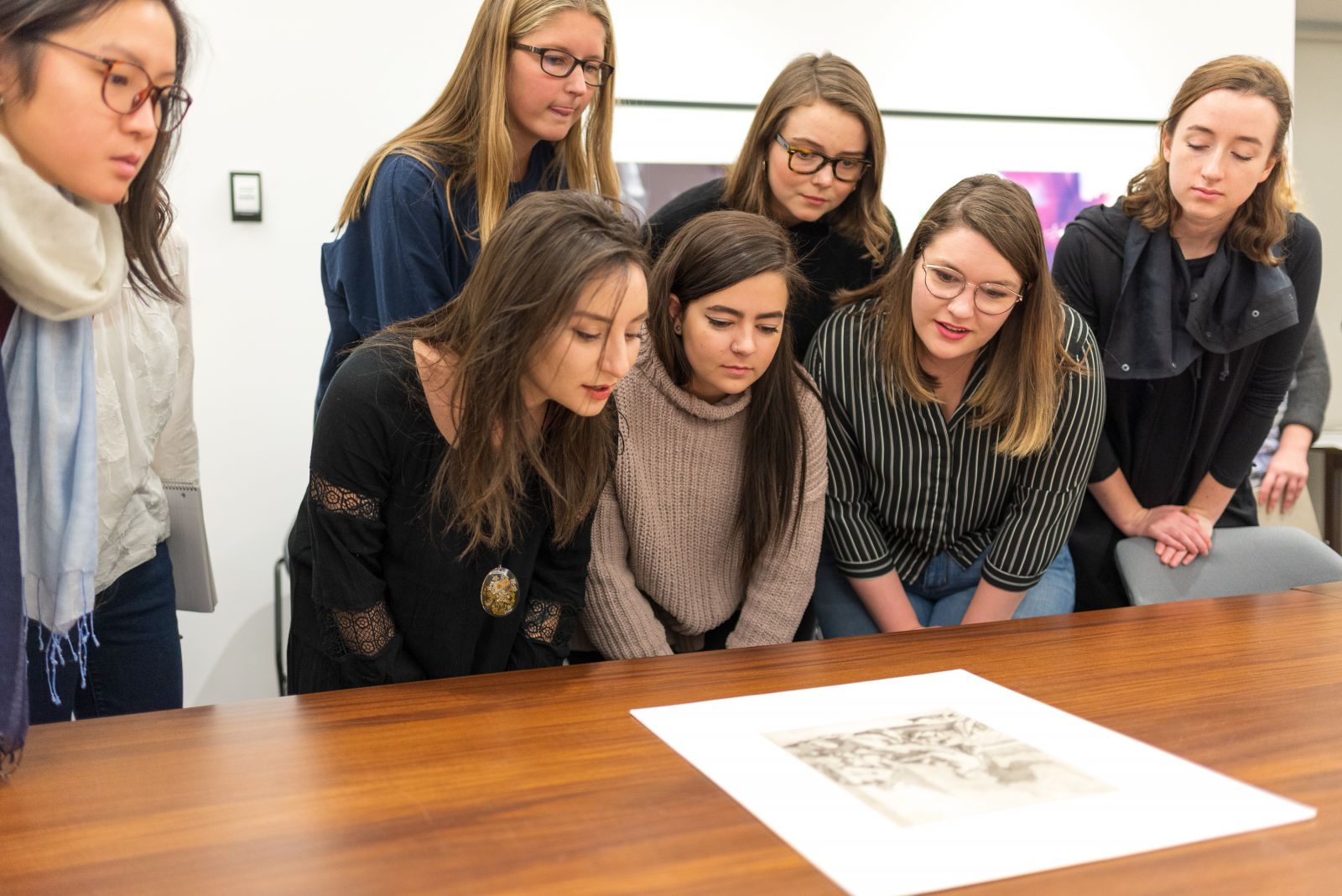 students around a picture