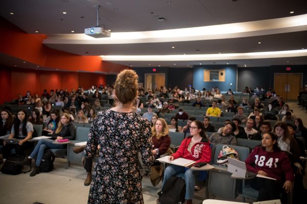 Professor teaching a lecture to room full of students