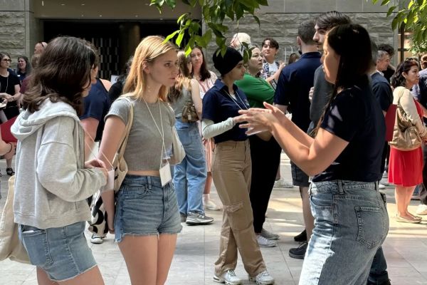 Incoming students speak with upper-year Peer Ambassadors during a Summer Orientation to Academics and Resources (SOAR) event at the BioSciences Complex.