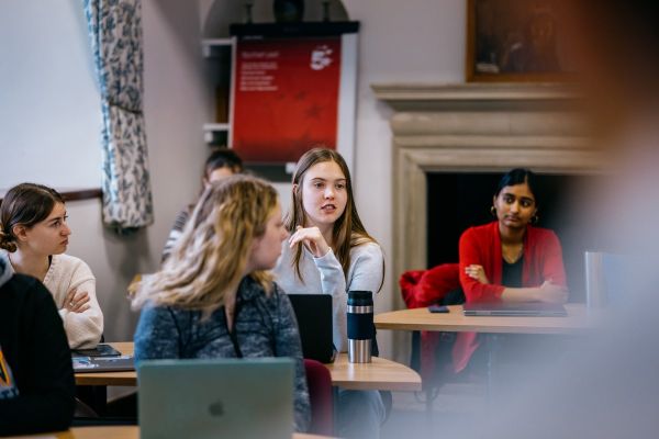 Students speaking to each other in a classroom