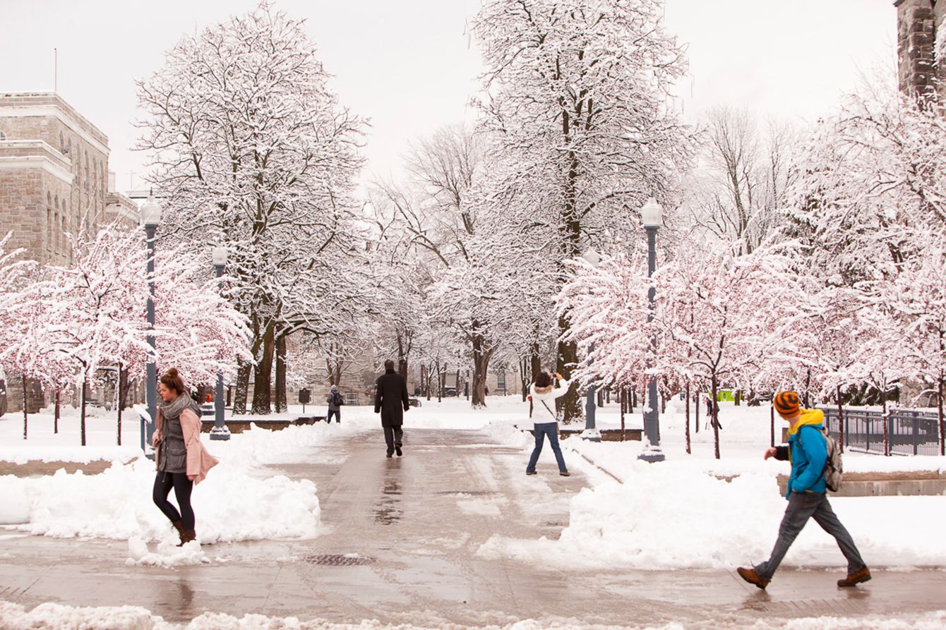 Students walking on Queen's campus in winter