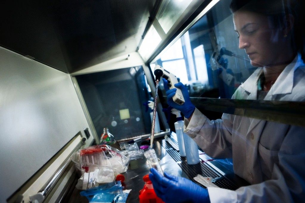 A doctor inserting a sample into a test tube