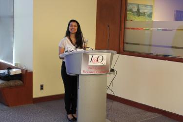 A student standing behind a podium