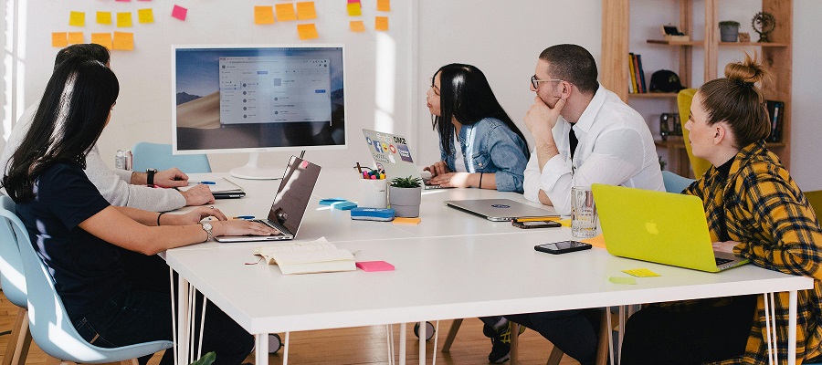 group of people looking at a screen