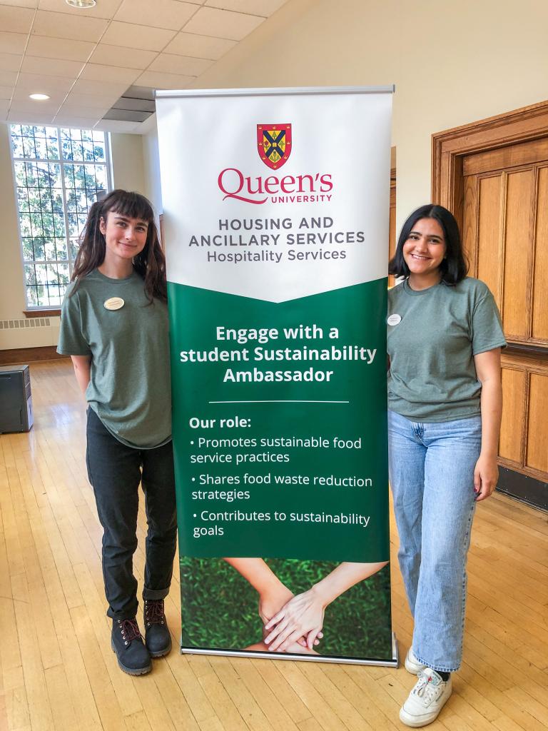 Sustainability Ambassadors standing with a banner