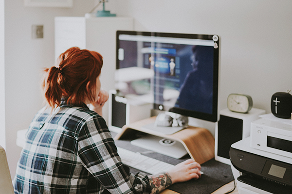 Woman working on comupter at home