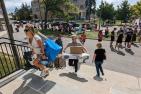 Student volunteers help a family during move-in