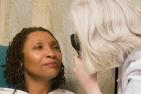 A woman undergoes an eye exam