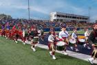 Queen's Bands in front of alumni at Richardson Stadium