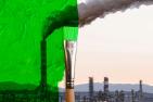 Green paint brush over a smokestack.