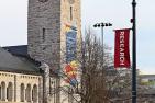 Research flags and building skin at Grant Hall on University Avenue.