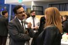 Fahim Quadir, Queen's Vice-Provost and Dean of the School of Graduate Studies, speaks with a student.
