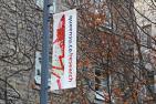 Research banner in front of a building