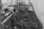 [Immigrants arrive in America aboard a ship]