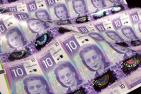 [A page of $10 bills featuring Viola Desmond - Bank of Canada photo]