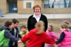 Wendy Craig, Queen's Head of Psychology on the playground with children.