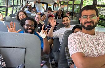 Participants of the Lake Shift 2024 pose for a photo on the bus as they head home.