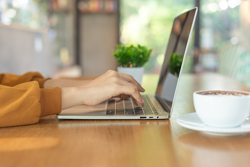 A person typing on a computer