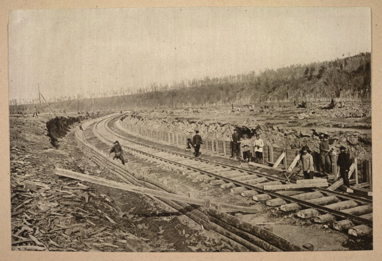 An old black and white photograph of a railroad being built