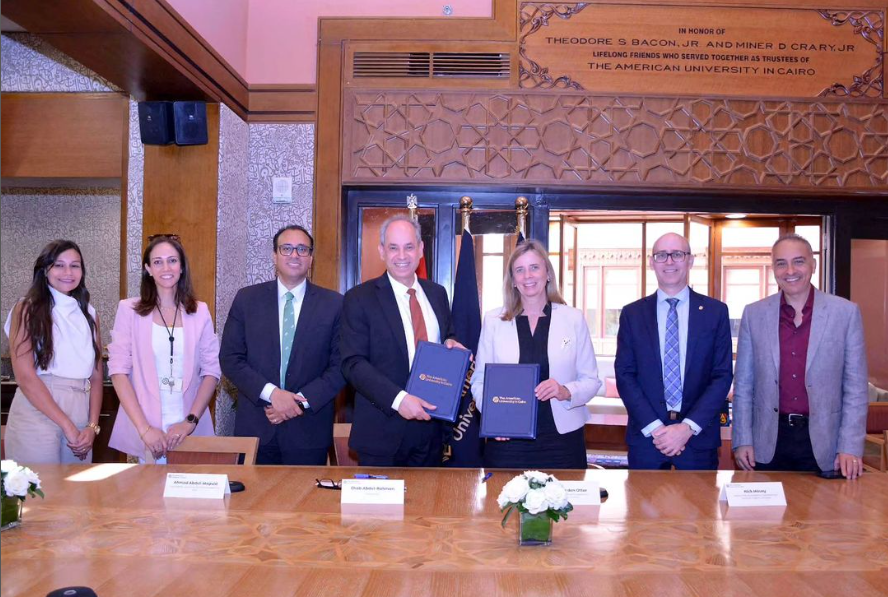 Photo of the agreement signing in Egypt, attended by Dr. den Otter, Dr. Mosey, and Dr. Hassanein. 
