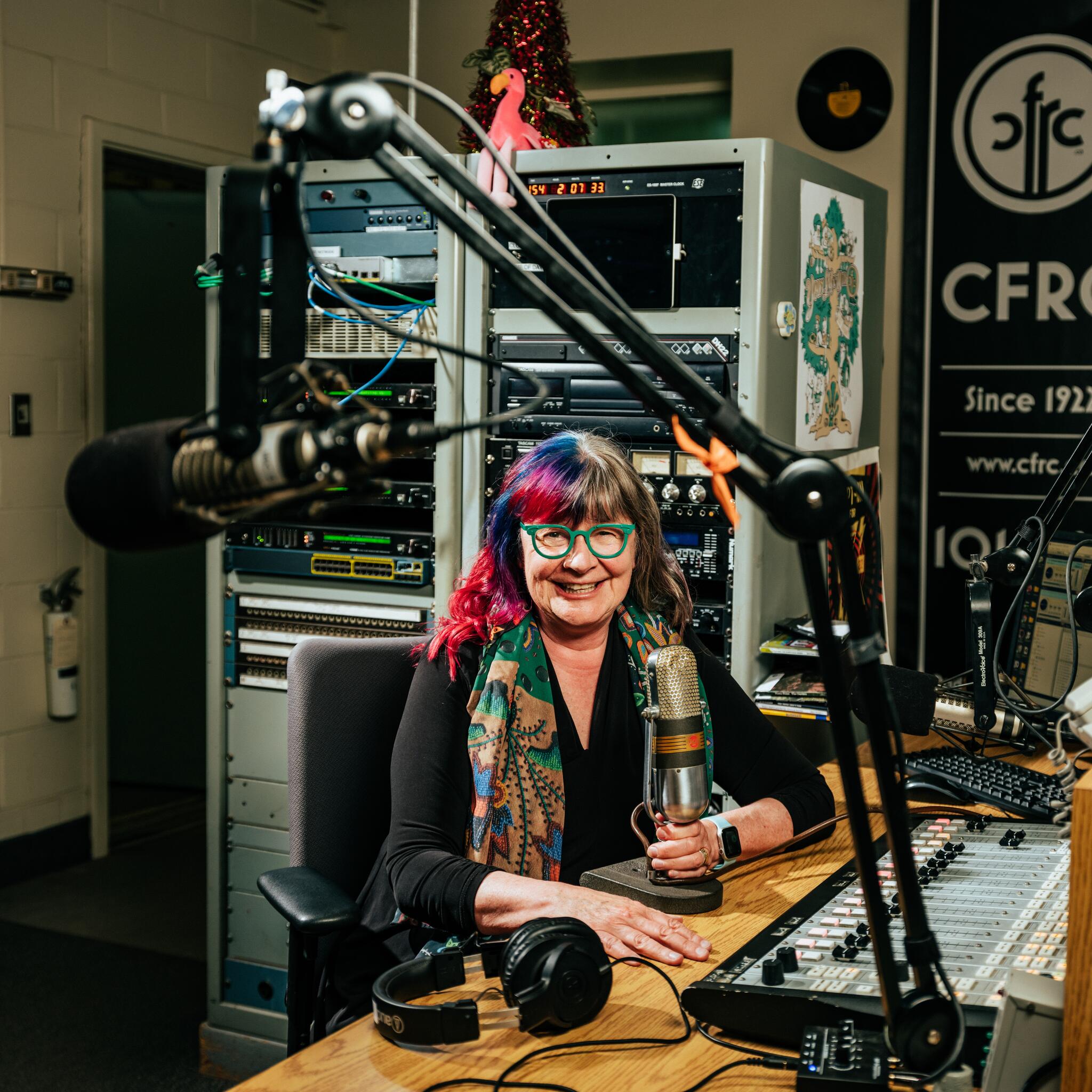 Woman sitting in CFRC radio booth