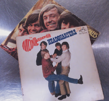 2 of "The Monkey's" records placed on top of each other so that you can see photos of the band on each.